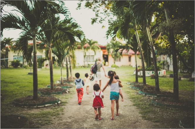 Winter 2017 - Rebuilding Innocence woman with children walking